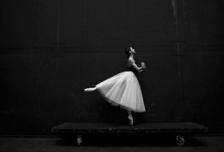 Ballet Flats - grayscale photography of ballet dancer standing on board