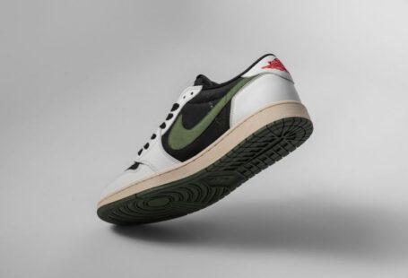 Clean Suede - a pair of white and green sneakers on a gray background