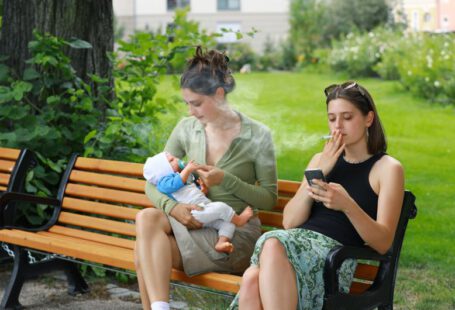 Heels Damage - two women sitting on a bench with a baby