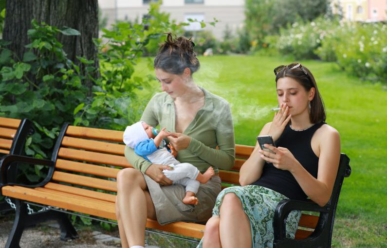 Heels Damage - two women sitting on a bench with a baby