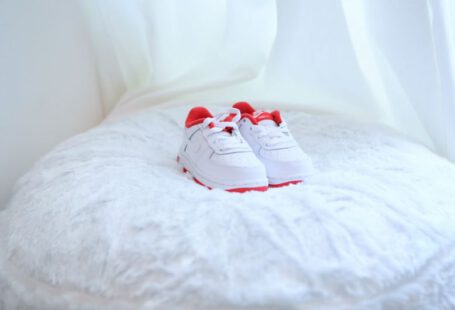 Children Shoes - white and red nike sneakers on white textile