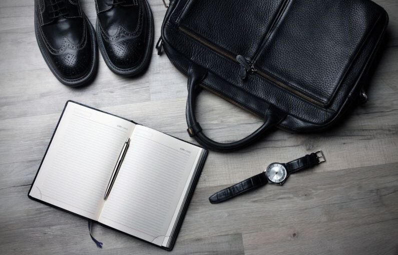 Eco Shoes - white notebook near black bag