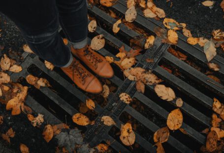 Seasonal Shoes - person wearing black leather dress shoes