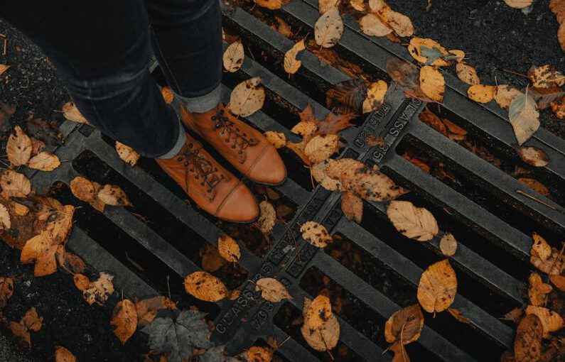 Seasonal Shoes - person wearing black leather dress shoes