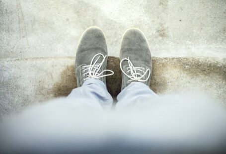 Clear Shoes - person taking a picture of gray shoes