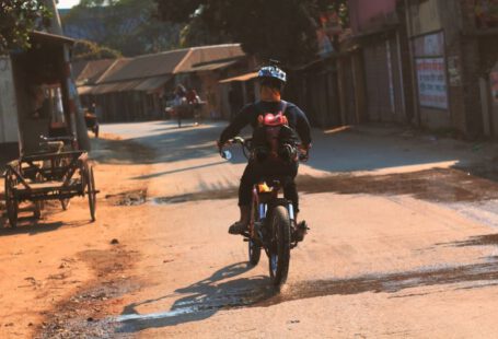 Diy Customization Shoe - a man riding a motorcycle down a dirt road