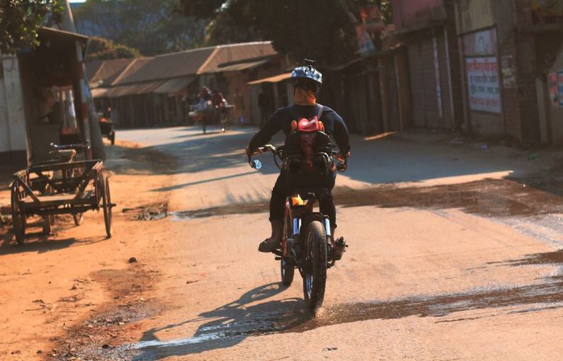 Diy Customization Shoe - a man riding a motorcycle down a dirt road