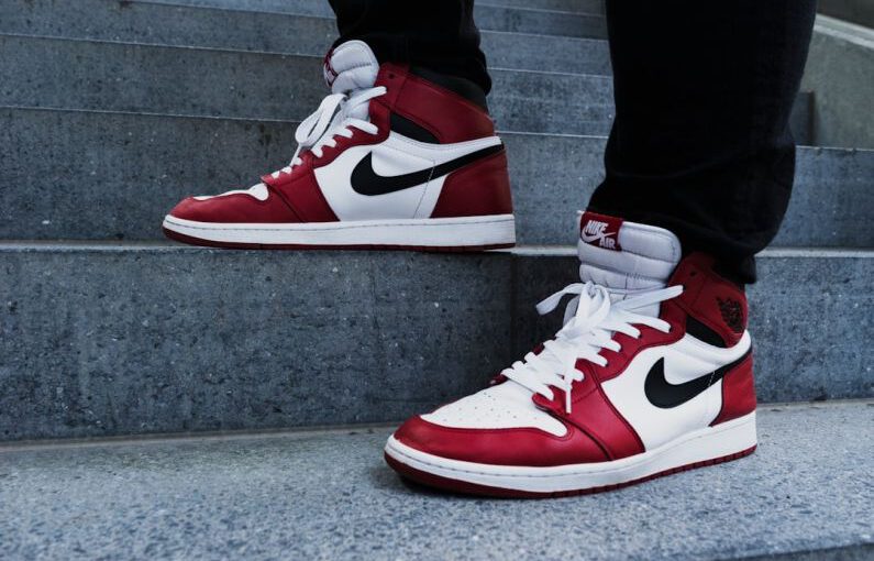 Adding Bling Shoes - person wearing pair of red-and-white Air Jordan 1 shoes