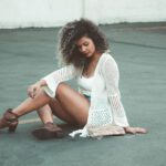 Chunky Boots - woman sitting on floor in shallow focus photography