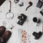 Shoes Vintage Transformation - camera, pair of brown shoes, white ceramic mug, grey and black pen, brown smoking pipe