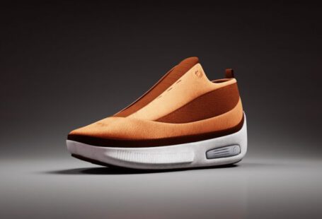 3d Printed Shoes - a pair of orange and white shoes on a gray background