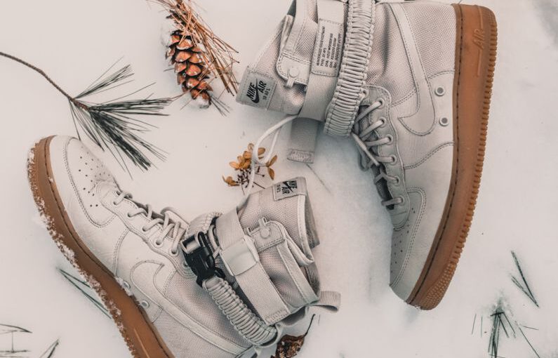 Shoe Trends - pair of gray Nike high-top sneakers on snow