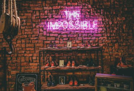 Classic Shoes - The Impossible neon light signage on brick wall