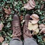 Boots Evolution - person standing on green grass