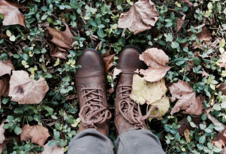 Boots Evolution - person standing on green grass