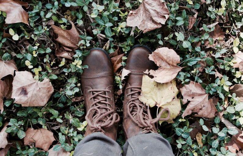 Boots Evolution - person standing on green grass