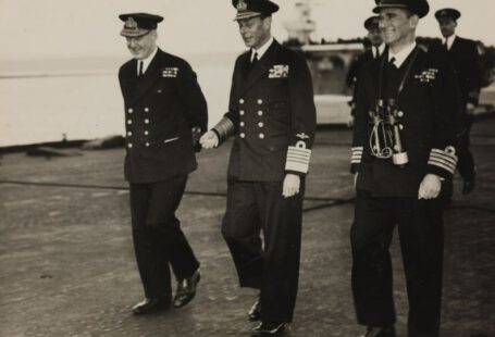 Royal Footwear - grayscale photo of three men walking on concrete pavement