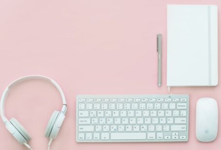 Minimalist Shoes - white Apple Magic Mouse beside of Magic Keyboard and headphones