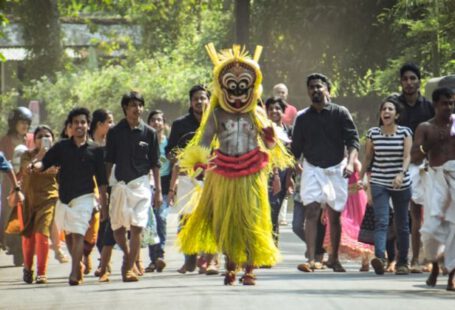 Folklore Shoes - group of people parade on the road during daytime