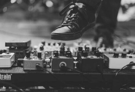 Shoe Production - person wearing black lace-up sneaker hitting the distortion