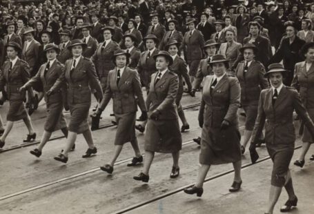 War Footwear - grayscale photography of group of women marching on road