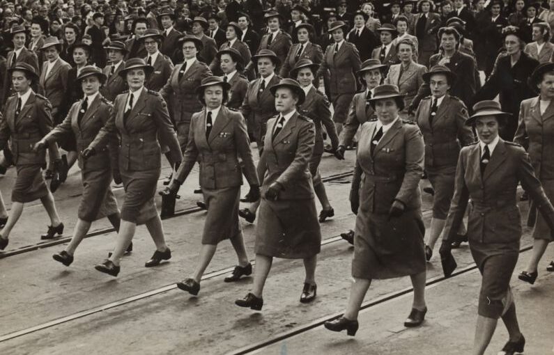 War Footwear - grayscale photography of group of women marching on road