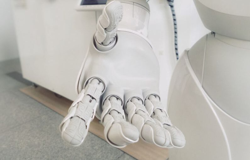 High-tech Footwear - closeup photo of white robot arm