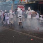 Vegan Shoes - people in white uniform walking on street during daytime