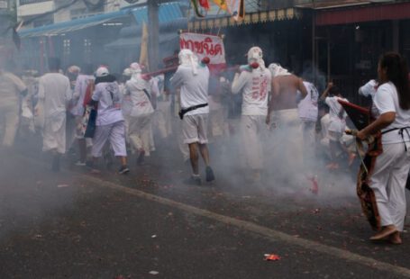 Vegan Shoes - people in white uniform walking on street during daytime