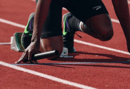 Sneakers Vs Athletic - man on running field